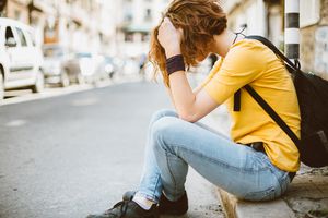 Sad teenage girl at the street