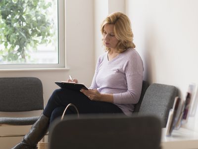 Woman completing questionnaire