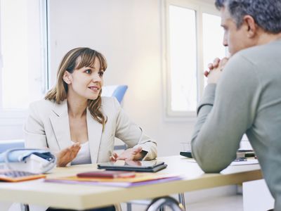 Woman In Consultation with Doctor