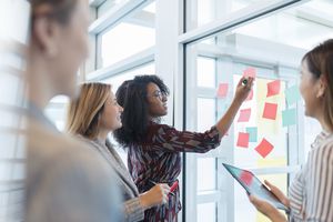 Woman making decisions in meeting