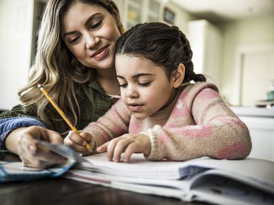 mom helping her daughter with homework