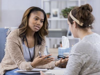 A therapist talking to a client.