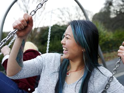 Woman smiling on swing