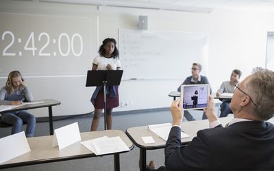 Student doing a debate in front of the class.