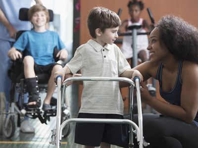 Physical therapists helping children