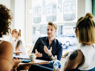 Group Of Colleagues Discussing Ideas Together