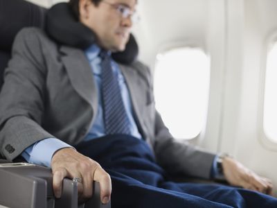 Nervous passenger sitting on airplane