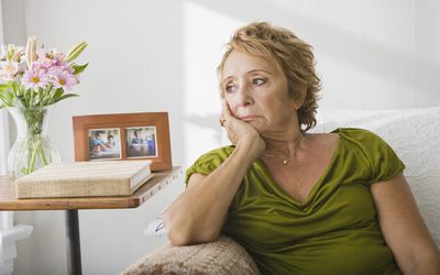 sad woman on the couch