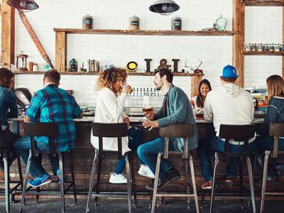 People drinking beer at a bar