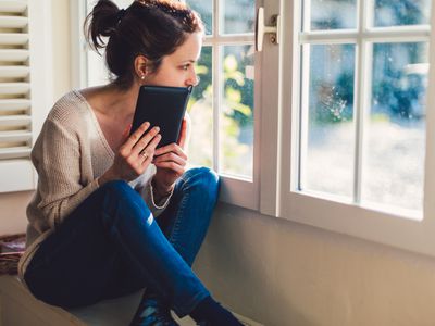 woman looking out window