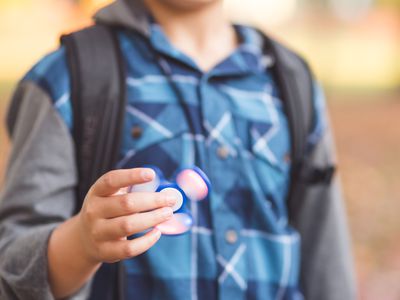 Boy with fidget toy.