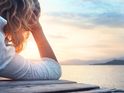 woman looking at sunset