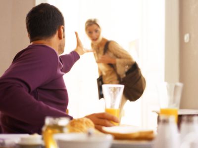 Man gesturing to woman leaving.