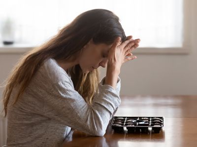 Young woman stress eating chocolates