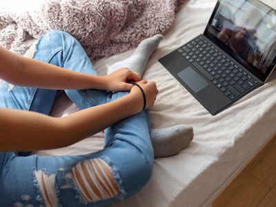 girl has psychotherapy session with her therapist via video call