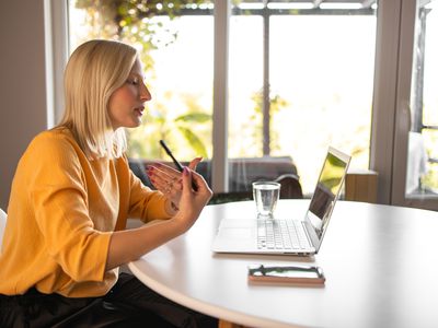 Young woman doing online therapy on her laptop