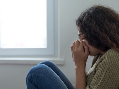 Girl experiencing a panic attack at home