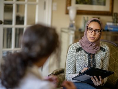 Therapist and patient in counseling session.