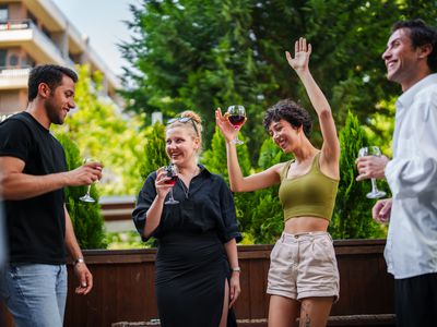 couples partying on a deck outside