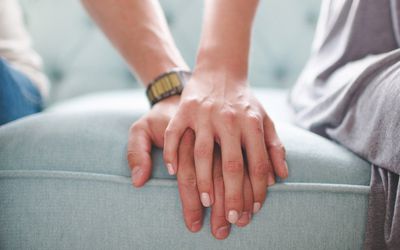 couple holding hands supporting each other 