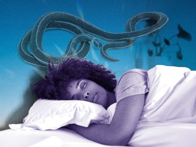 woman lying in bed dreaming about snakes