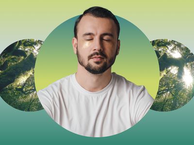 Man closing his eyes meditating against a rainforest backdrop