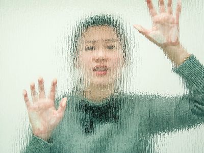 Woman Behind Transparent Wall