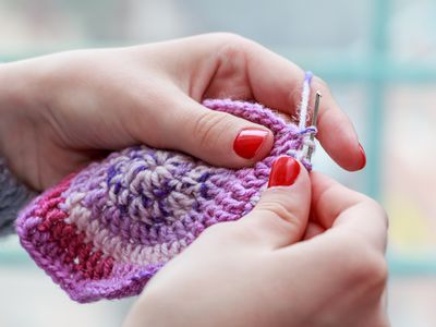 Woman crocheting a hat