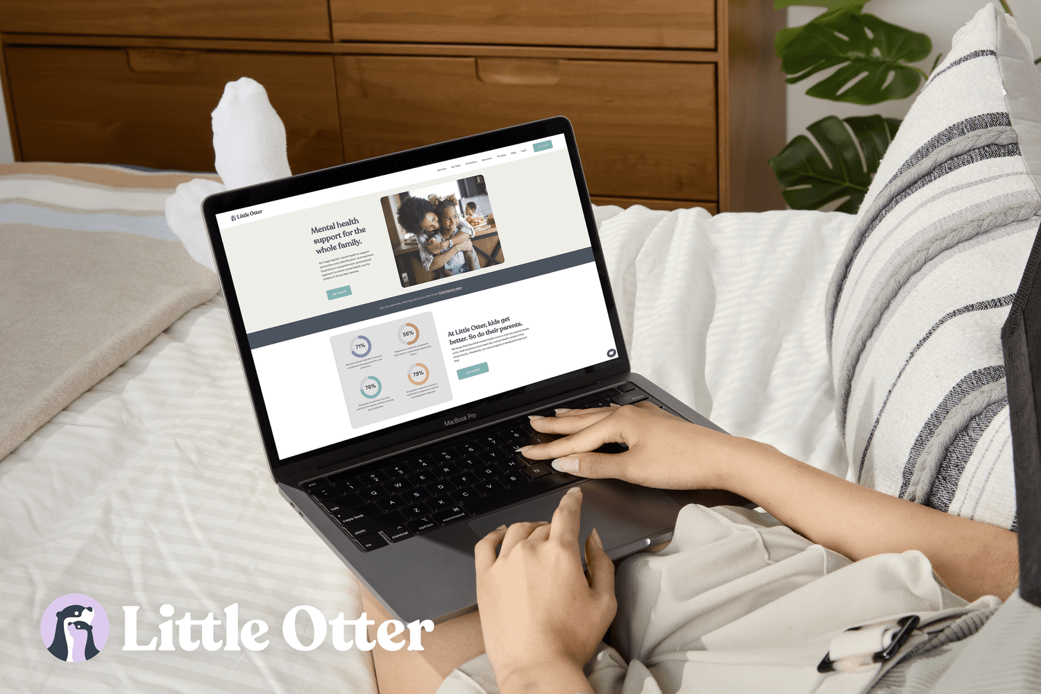 Person using laptop on Little Otter website
