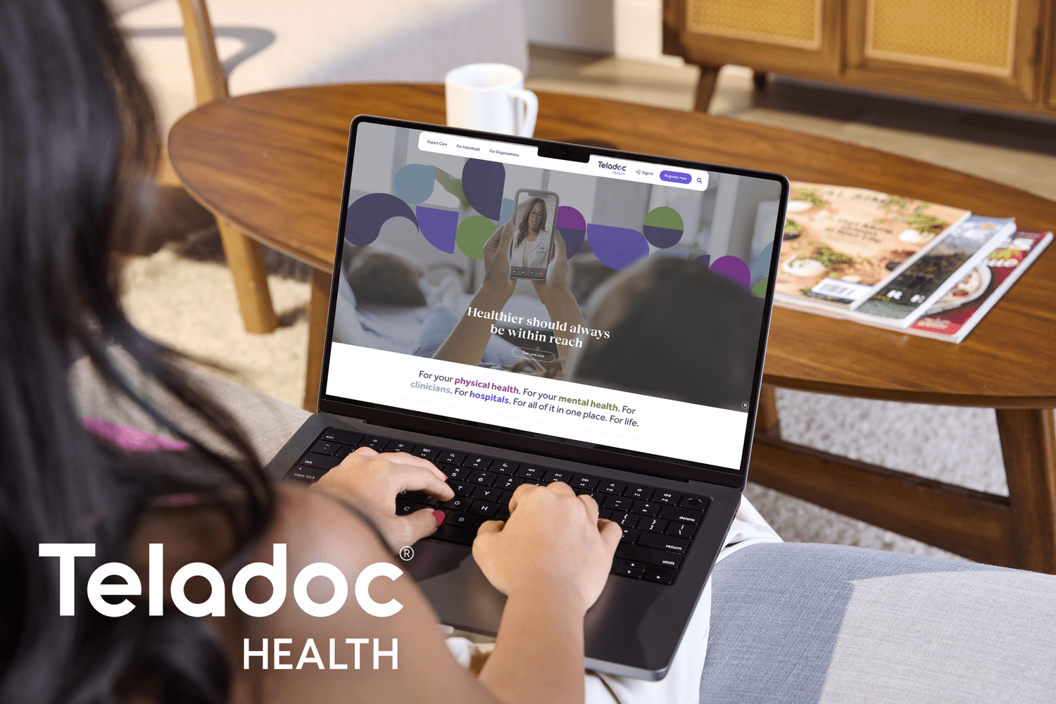 Person using laptop on Teladoc website