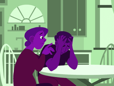 A person sitting at their kitchen table, hands on their head, looking distressed and upset. A family member should have their hands on the distressed person’s shoulder, looking concerned 